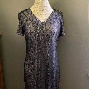 Vintage Harlow elegant floor length, black lace gown with fringe trim